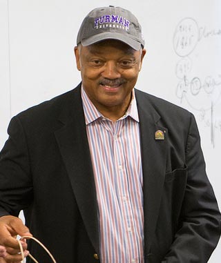 Jesse Jackson donned a Furman cap after teaching in Diane Vecchio's history class.