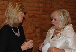 Furman President Elizabeth Davis, left, chats with Karen Corn of Greer State Bank at the Women's Forum on Work and Life Balance.